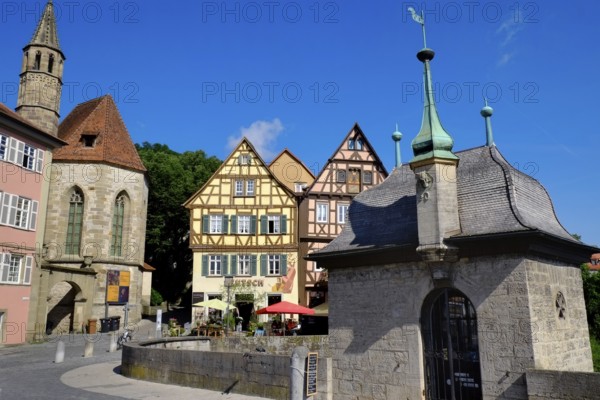 The Henkersbrücke bridge in Schwäbisch Hall spans the River Kocher. Opposite the Johanniter church