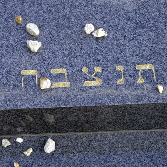 Jewish gravestone with small stones left behind, signalling that the deceased is not forgotten.