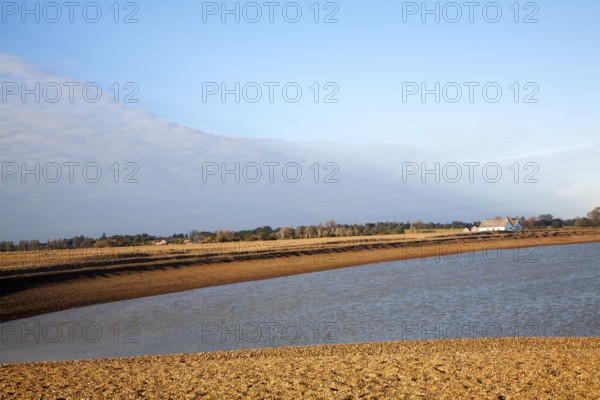 Seaside bungalow on shingle beach near North Weir Point, Shingle Street, Suffolk, England, UK