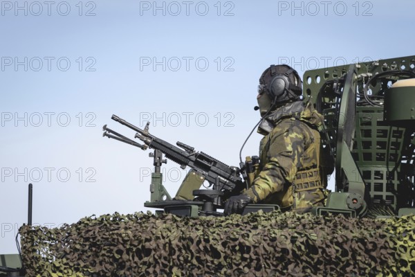 A Czech soldier occupies the hatch of a protected vehicle as part of the military exercise