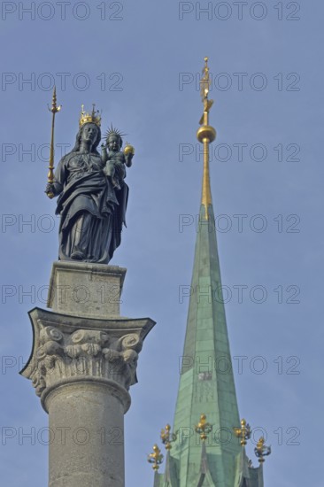 Madonna figure with golden crown and blurred spire of Our Lady, Minster, sceptre, baby Jesus, arm,