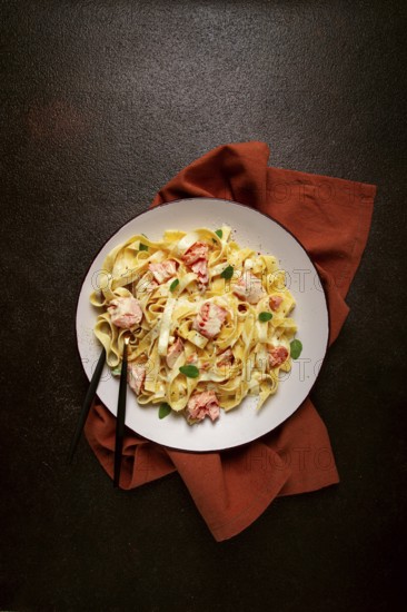 Tagliatelle pasta, in cream sauce with salmon, homemade, no people