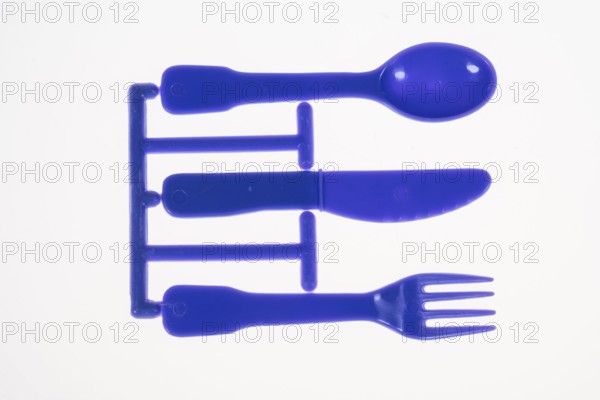 Plastic cutlery, spoon, knife, fork, still on the cast strand, children's cutlery