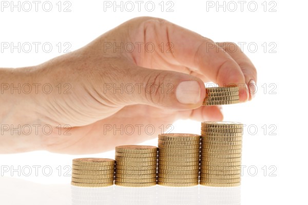 A hand with a stack of 50 cent coins, Vienna, Austria, Europe