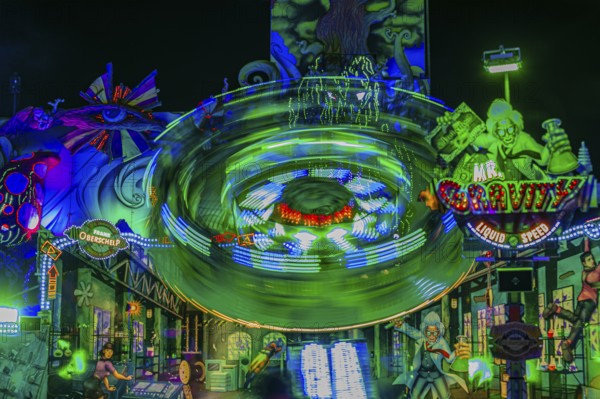 Illuminated ride Mr Gravity in motion, night shot, Oktoberfest, Festwiese, Theresienwiese, Munich,