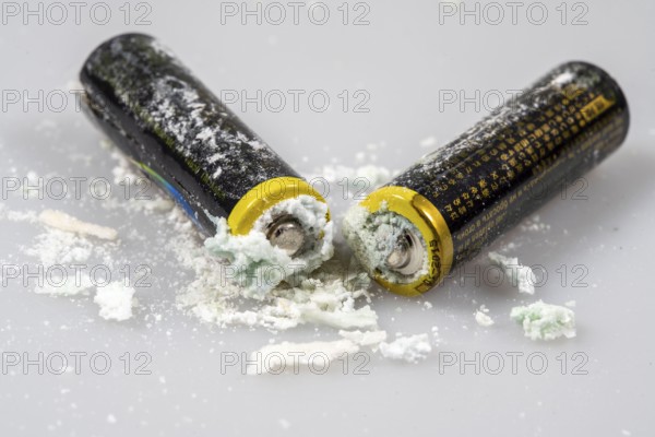Leaked batteries, AA batteries, oxidised, leaked potassium carbonate and ammonium chloride