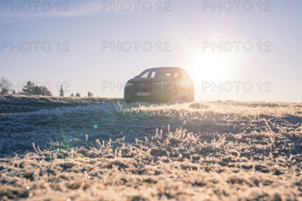 An SUV in a frosty landscape at sunrise, car sharing, electric car, Volkswagen ID 5, Gechingen,