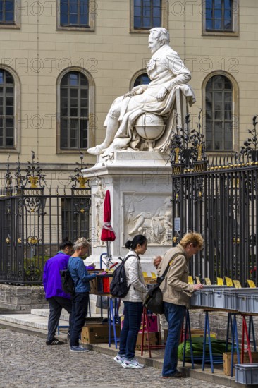 Tourists at the flea market stall in front of Humboldt University, Unter den Linden, Berlin,