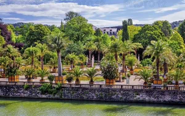 Castle moat with palm garden in the spa gardens, the largest outdoor palm garden north of the Alps,