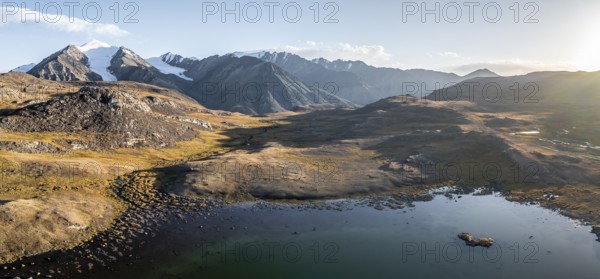 Aerial view, mountain peak and mountain lake, evening mood, Arabel Lake at Arabel Pass, Issyk Kul