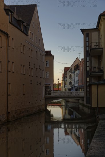 Last rays of sunshine over the river Vils surrounded by houses, Amberg, Upper Palatinate, Bavaria,