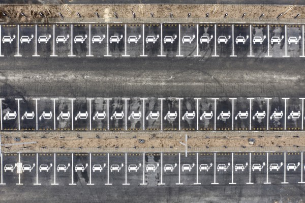 Aerial view of charging stations for electric cars at the Tesla Gigafactory in Grünheide, 28 01