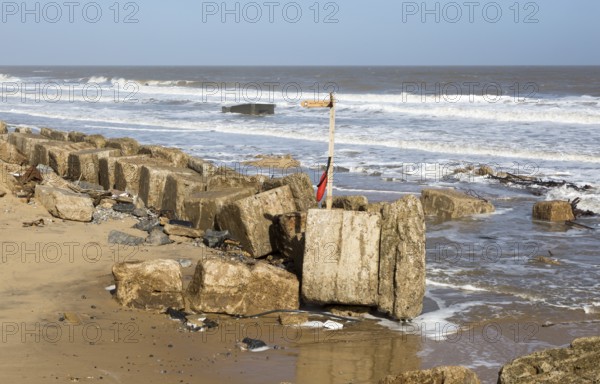 March 20 2018 Hemsby, UK. Coast path sign left abandoned by coastal erosion at Hemsby, Norfolk,