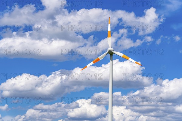 Wind turbine, wind energy plant from the manufacturer Enercon, blue sky with many white clouds,