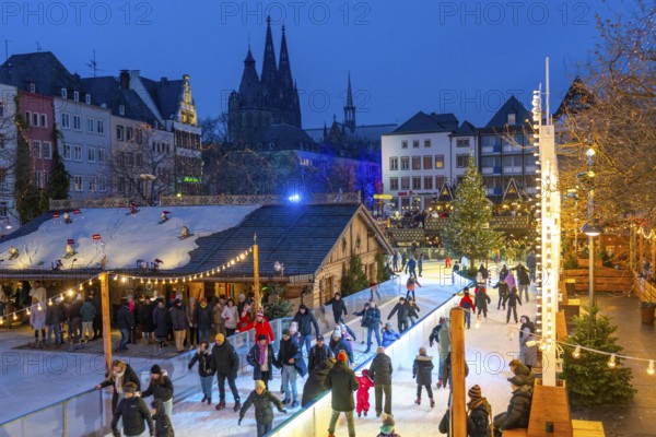 Ice rink at the Christmas market on the Heumarkt in the old town of Cologne, Cologne Cathedral,