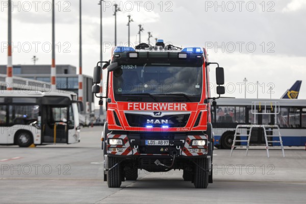 Airport fire brigade fire engine on the BER tarmac during an EASA emergency exercise. Emergency