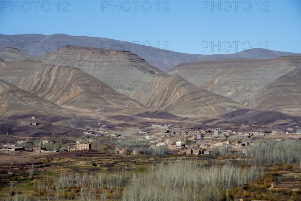View of Taboulmante with colourful mountains in the background, layered landscape, Gorges du Dades,