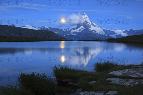Matterhorn and mountain lake, Stellisee, Valais, Switzerland, full moon, Europe