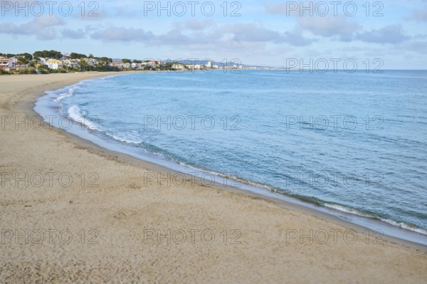 Breaking waves on a sandy beach, sunny, near Tarragona, Catalonia, Spain, Europe