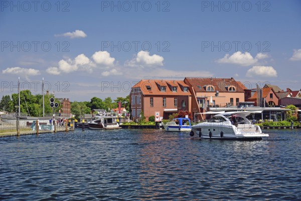 Europe, Germany, Mecklenburg-Western Pomerania, island town of Malchow, Lake Malchow, at the swing