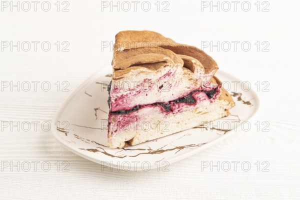 Zephyr or marshmallow cake on white wooden background. side view, close up