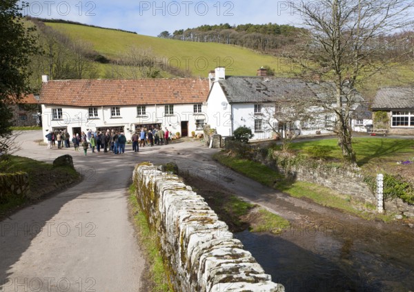 Groups of people outside Lorna Doone Farm, Malmsmead, Exmoor national park, Devon, England, United