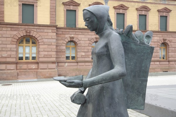 Sculpture shoe carrier and monument to former shoe industry, shoe production, shoe carrier,