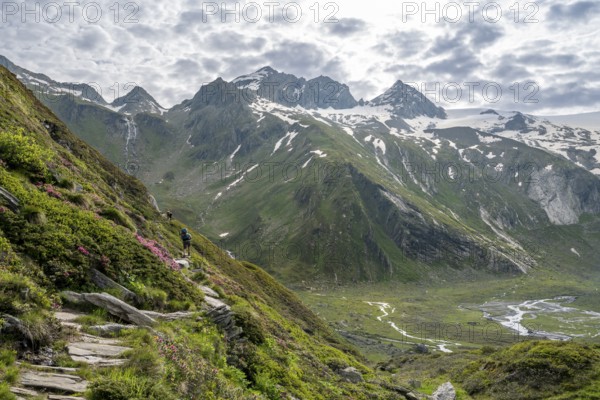 Picturesque mountain landscape with hiking trail, mountain peak with snow, peak Großer Mörchner,