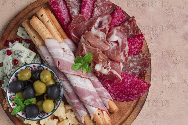 Appetizer, assortment, set, sausage, and cheese, on a wooden board, top view, no people