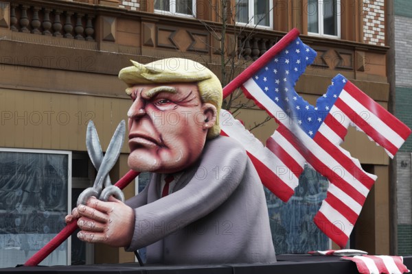 Donald Trump cuts a swastika flag out of the US national flag, danger to democracy, papier-mâché