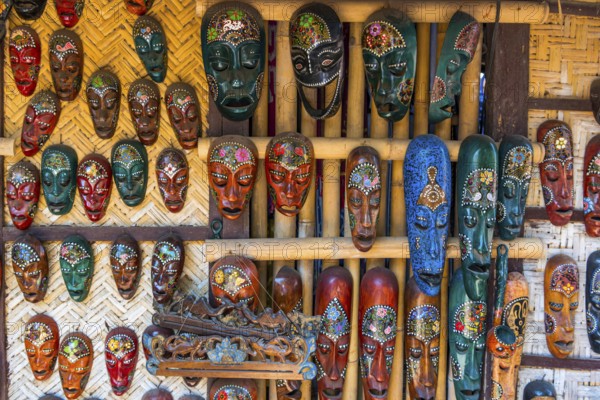 Traditional wooden masks on a market, colourful, handcraft, craftsmanship, tradition, face, travel,