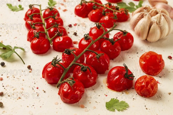 Baked branch, mini, cherry tomatoes, with spices and herbs, garlic, food background, top view, on a