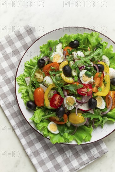 Vegetable salad, with quail eggs and olives, fresh, close-up, no people