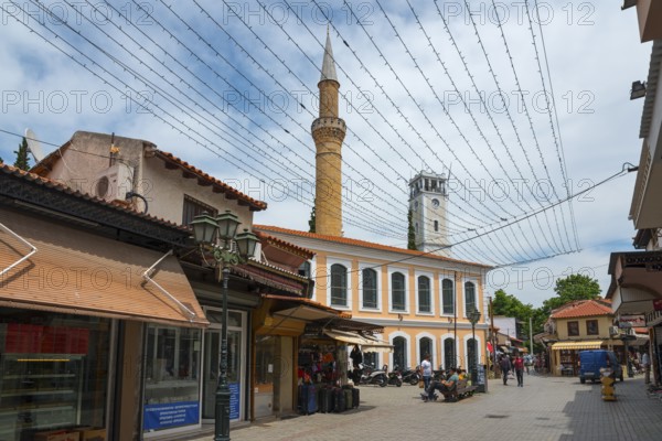 Tourist street with a minaret and shops under a network of fairy lights, New Mosque and Clock