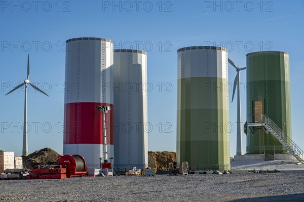 Construction site of a new wind turbine, modules of the tower, wind turbine from the manufacturer