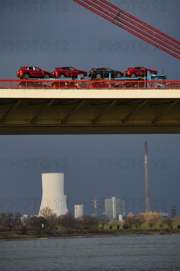 Beeckerwerther Brücke, motorway bridge, A42, truck, cargo ship on the Rhine, behind the STEAG