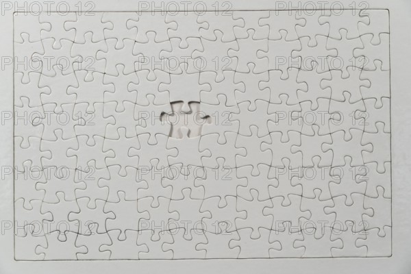 Puzzle game, blank, white, without motif, for printing, one piece missing