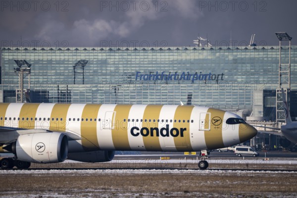 Condor, aircraft, on the taxiway at Frankfurt FRA airport, Fraport, in winter, Hesse, Germany,