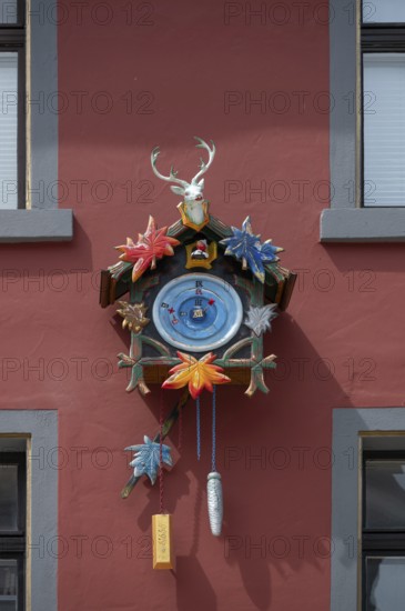 Colourful cuckoo clock on a house, Villingen-Schwenningen, Baden-Württemberg, Germany, Europe