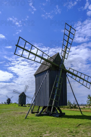 Three traditional historic windmills (Resmo väderkvarnar) in the village of Resmo on Öland, Kalmar