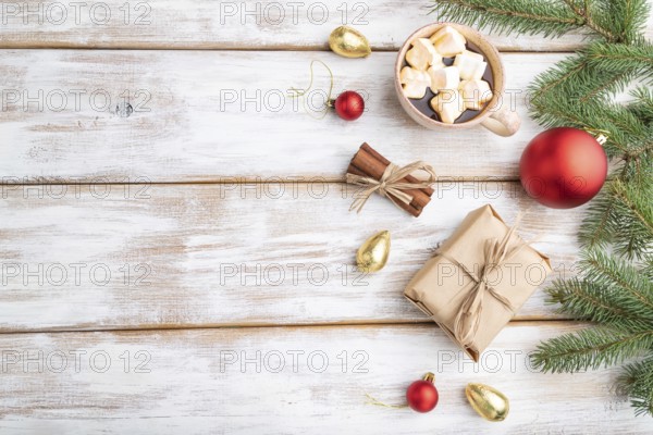 Christmas or New Year composition. Decorations, box, red balls, cinnamon, fir and spruce branches,