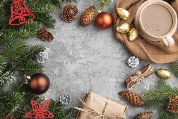 Christmas or New Year frame composition. Decorations, cones, cinnamon, fir and spruce branches, cup