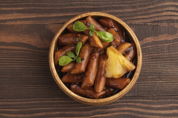 Tteokbokki or Topokki, fried rice cake stick, popular Korean street food with spicy jjajang sauce