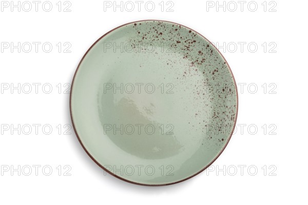 Empty blue dotted ceramic plate isolated on white background. Top view, close up