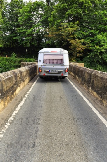 Eriba Touring caravan drives over single lane bridge, River Dee, cult, retro, Llangollen, Wrexham,