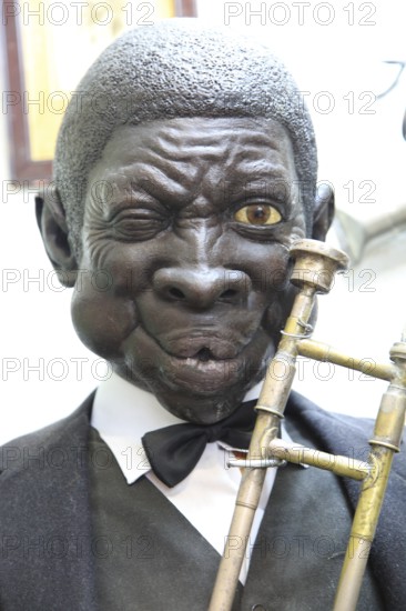 Mannequin figure black male jazz musician inside famous historic Los Gatos Cervecerias bar, Madrid,