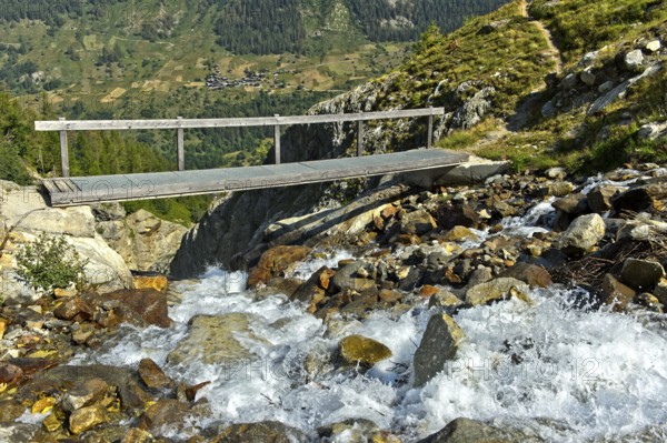 Narrow bridge over the Nästbach torrent on the way to the Bietschhorn hut, near Blatten,