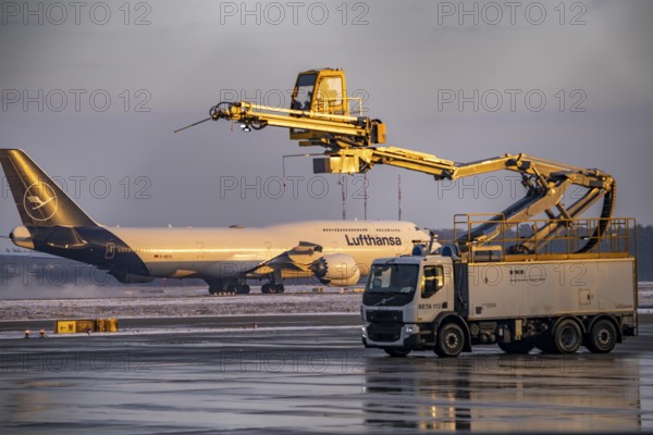 Winter at Frankfurt Main Airport, FRA, de-icing vehicles waiting for aircraft to be de-iced, Hesse,