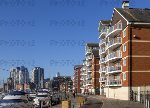 Apartments and high rise flats with boats in marine on the waterfront, Wet Dock, Ipswich, Suffolk,