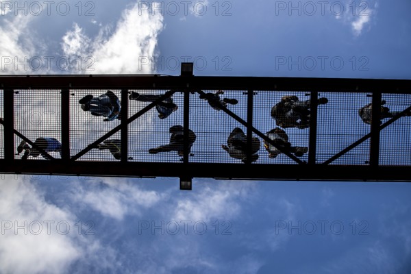 Lattice walkway, people walk over a walkway at a height of a good 15 metres, made of steel lattice,